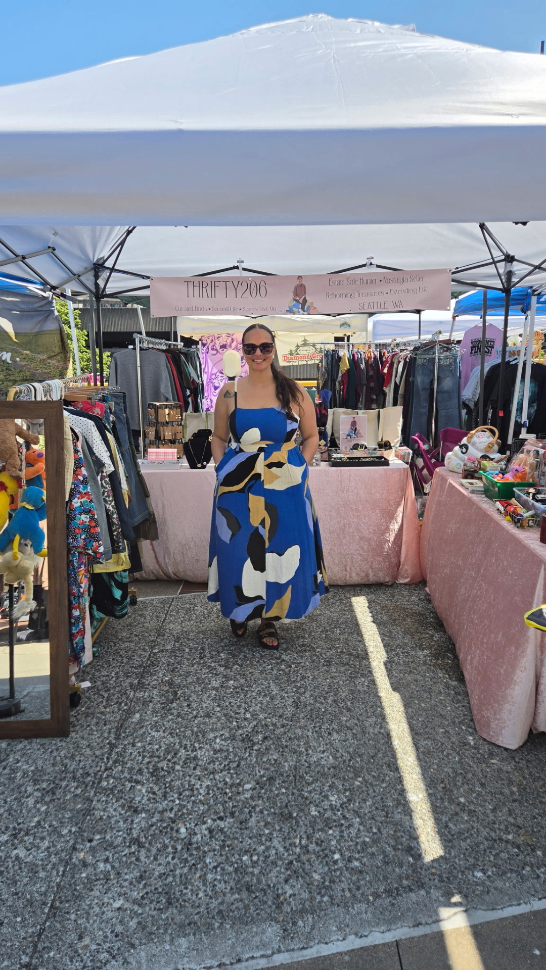The owner of Thrifty206 at her curated pop-up booth in Seattle, Washington